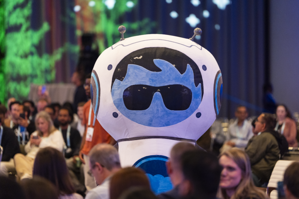Agent Astro Character interacting with session attendees.
